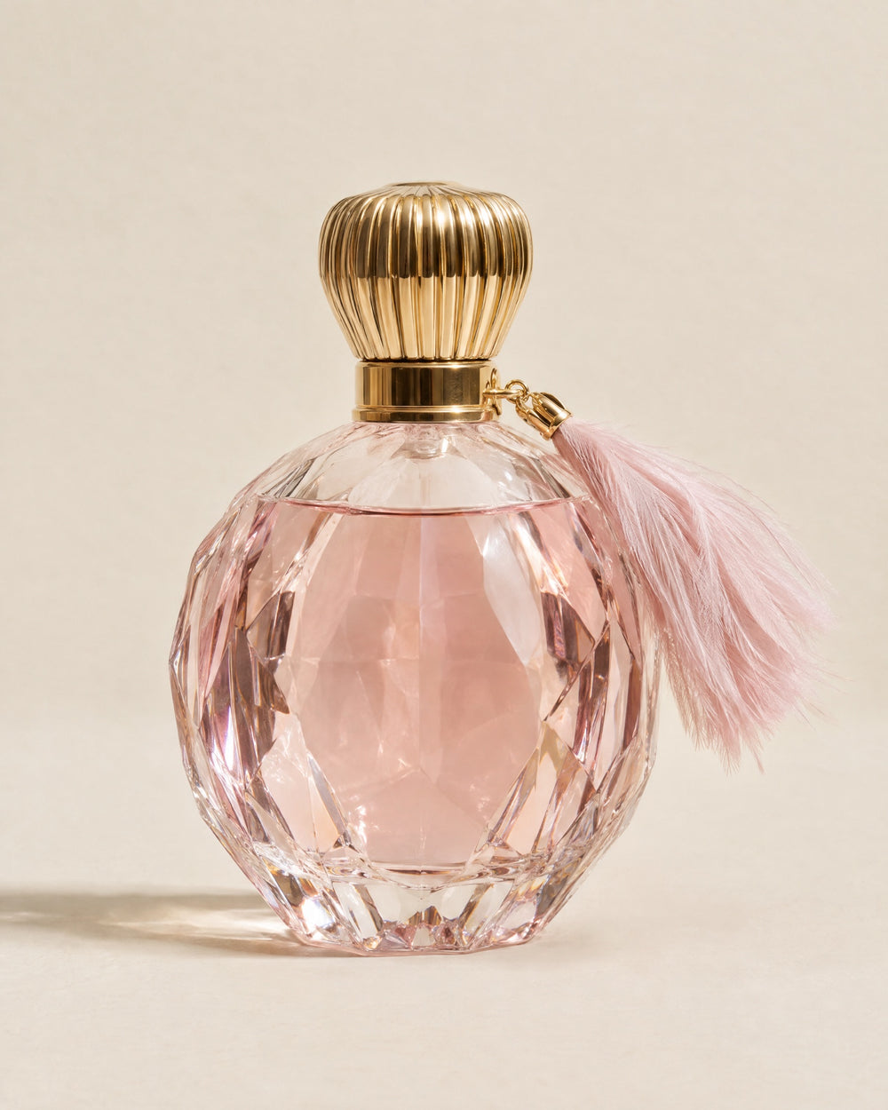 La Comtesse extrait de parfum in a pink cut-crystal flacon with a feather tassel