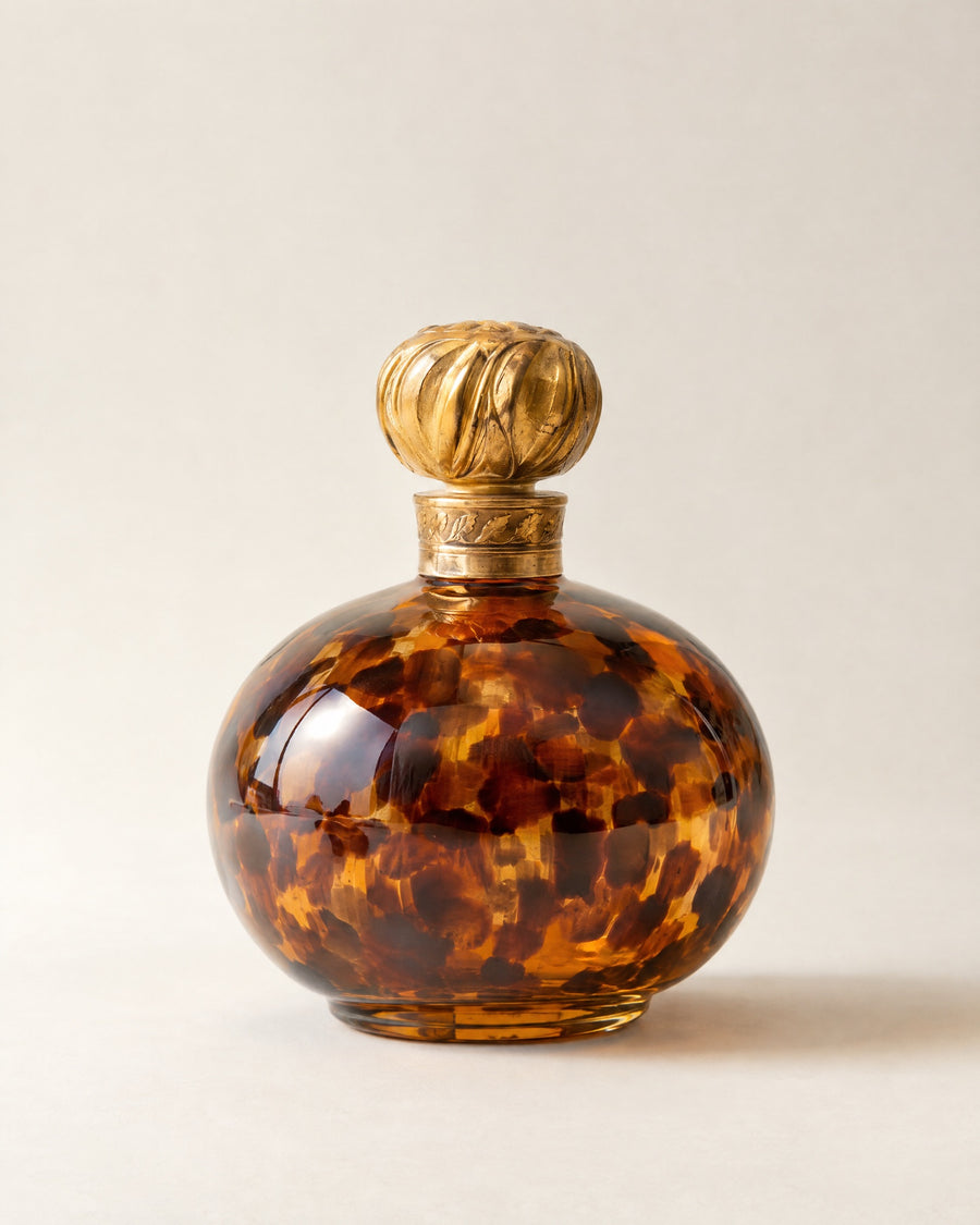 La Tigresse extrait de parfum in a hand-painted tortoiseshell flacon with a carved gold stopper