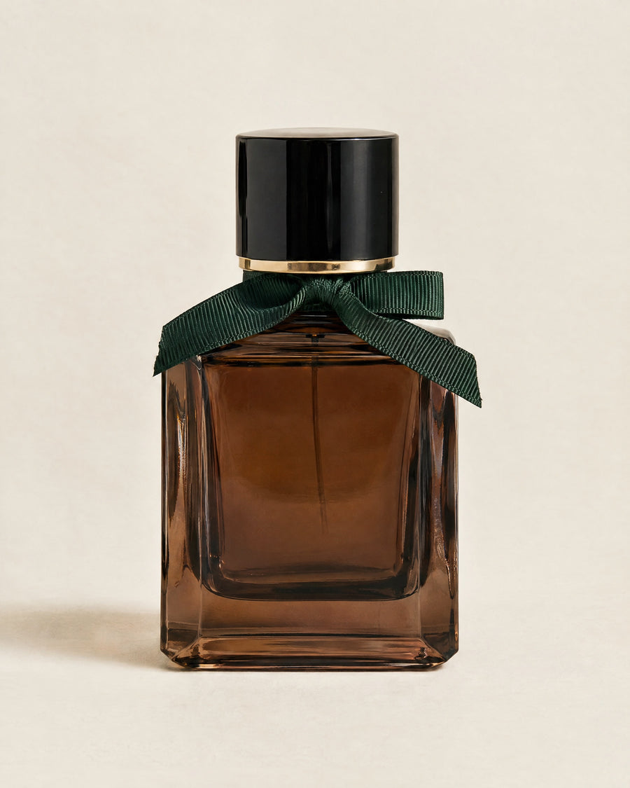 Le Dandy eau de parfum in a square smoked-glass flacon with a black lacquer cap