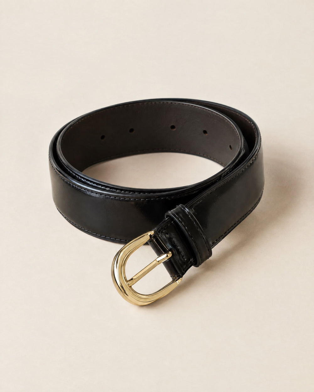Ceinture Arche: black calf belt with a gold arch-shaped buckle