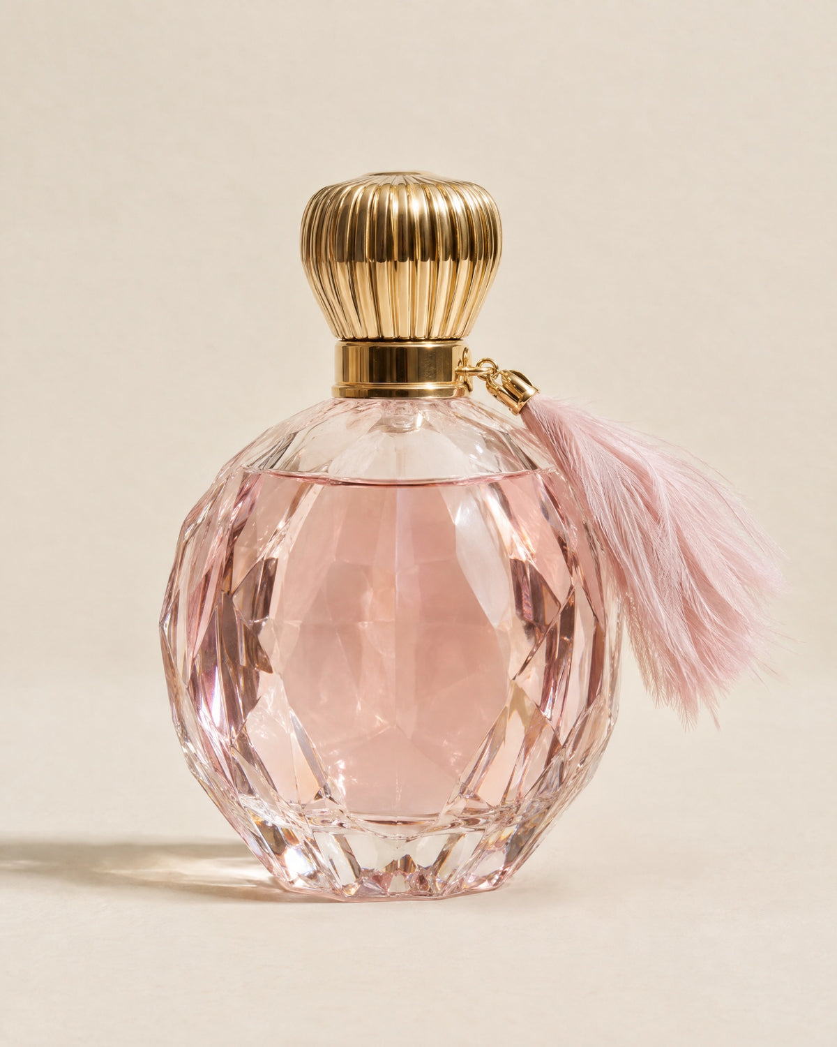 La Comtesse extrait de parfum in a pink cut-crystal flacon with a feather tassel
