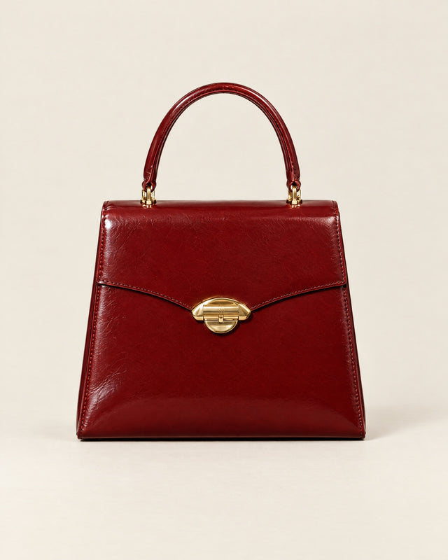 La Promenade top-handle bag in lacquer-red glazed calf, front view