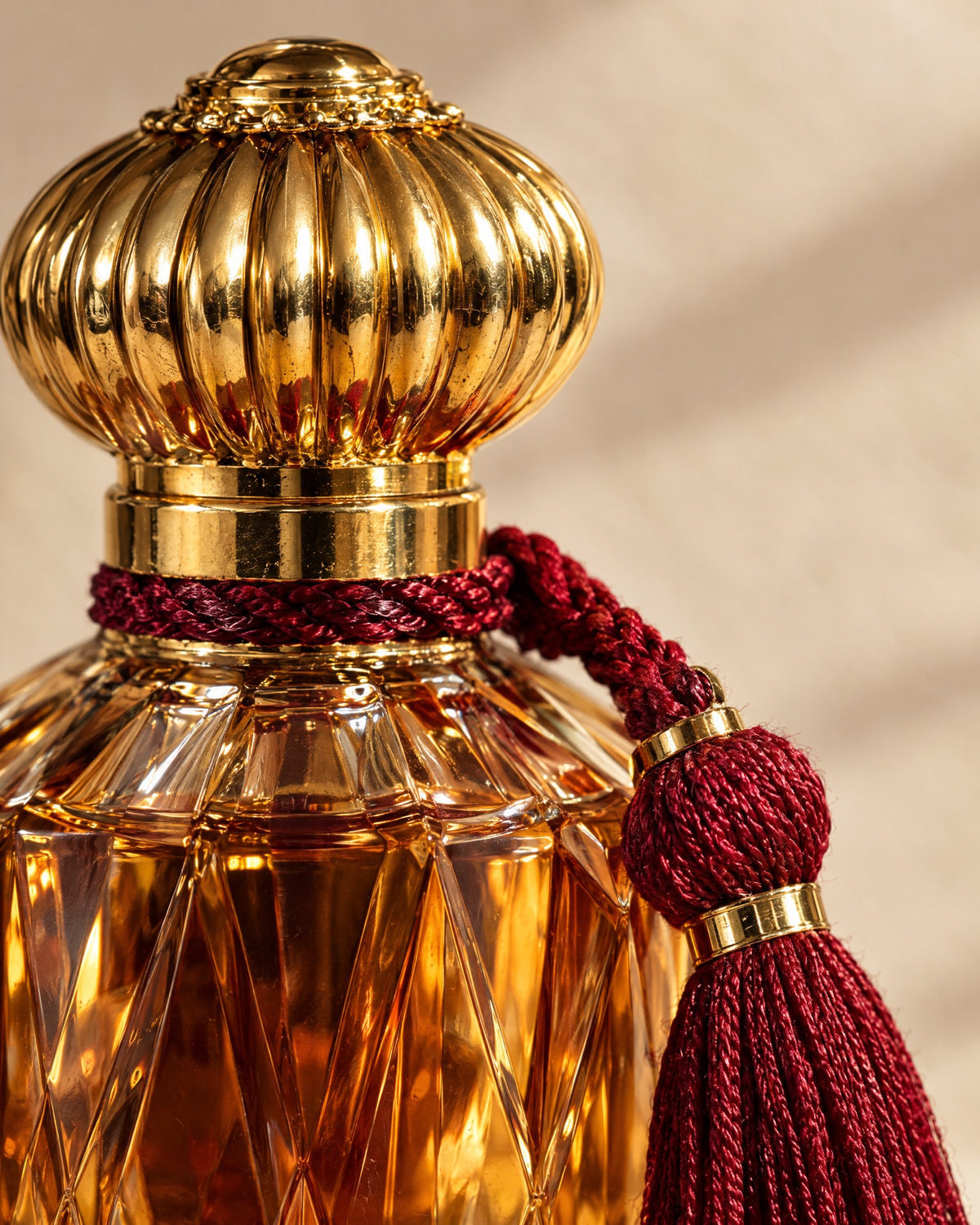 Close-up of the fluted gold cap and red silk tassel