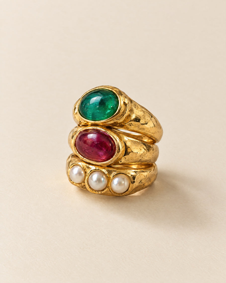 Les Trois Bagues in 18ct yellow gold: emerald, ruby and seed-pearl rings stacked