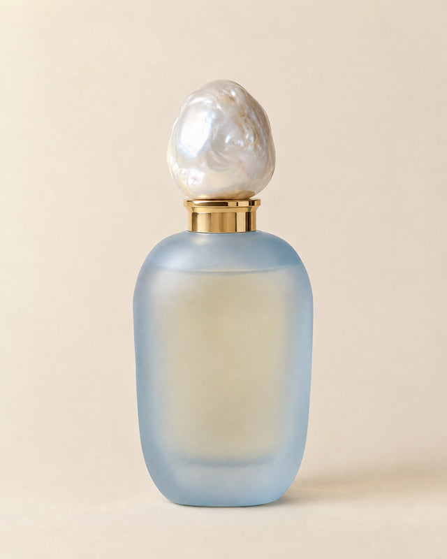 Madame Bleu eau de parfum in a frosted powder-blue flacon with a baroque pearl stopper