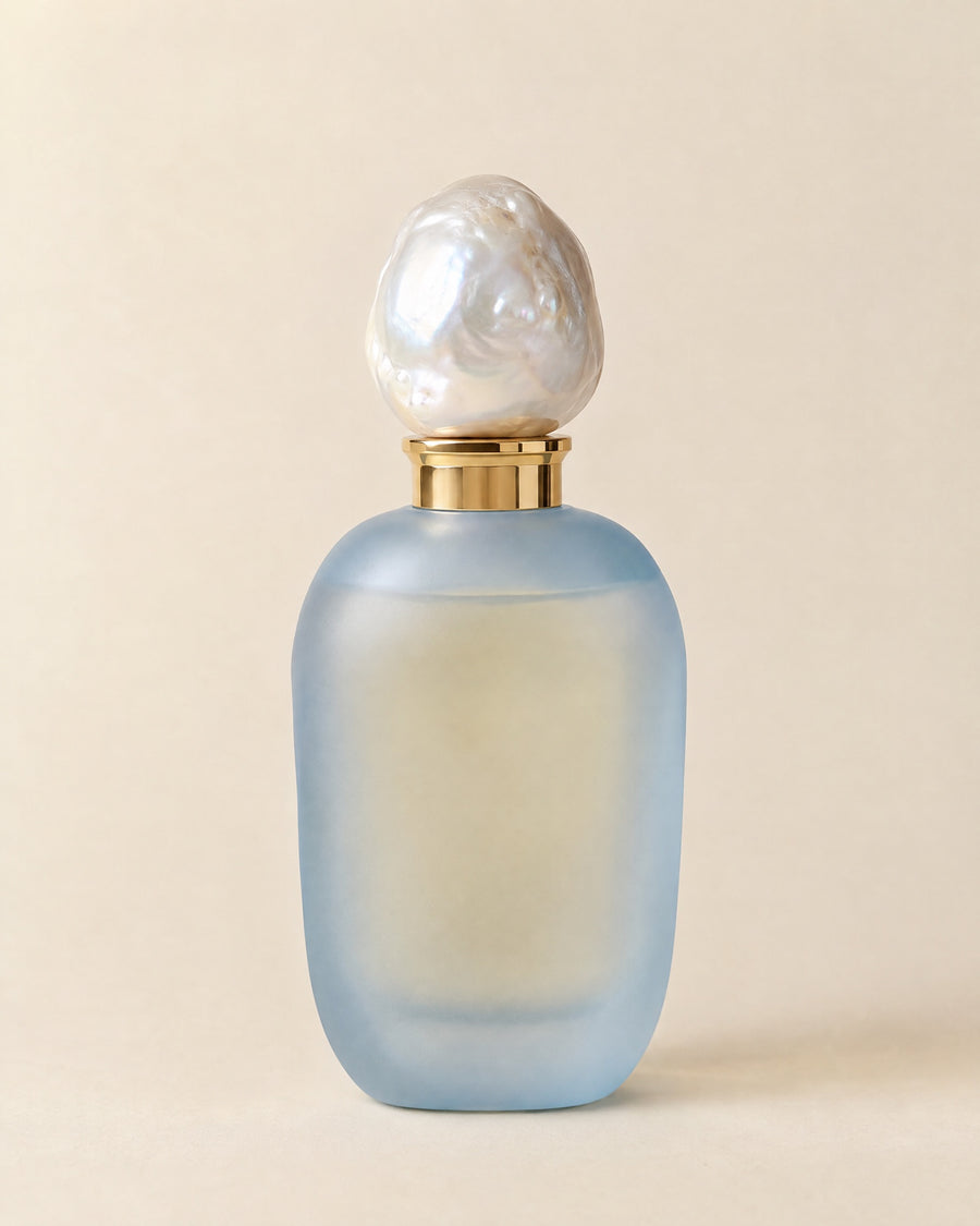Madame Bleu eau de parfum in a frosted powder-blue flacon with a baroque pearl stopper