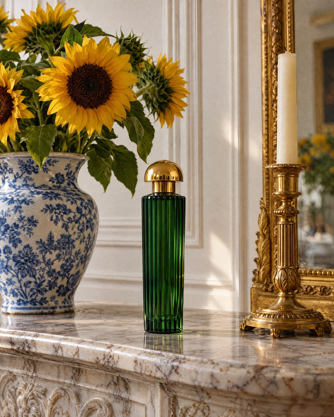 Tournesol on a marble mantel beside sunflowers in a blue-and-white vase